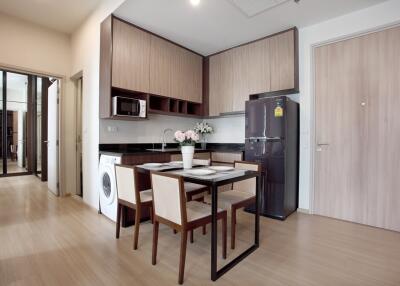 Modern kitchen and dining area with appliances