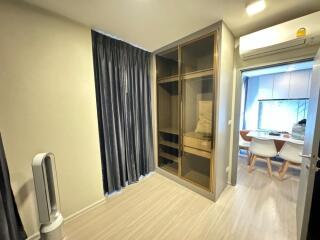 Bedroom with a large wardrobe and connected dining area