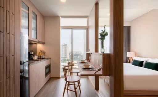 Modern studio apartment with kitchen and bedroom in an open plan layout