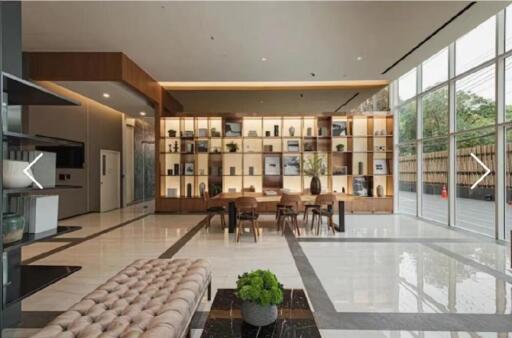 Modern lobby area with decorative shelving and seating