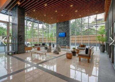 Lobby with seating area and glass walls