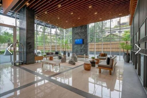 Lobby with seating area and glass walls