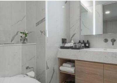 Modern bathroom with marble walls and vanity