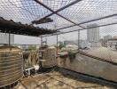 Rooftop with water tanks and city view