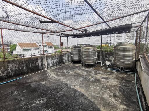 rooftop area with water tanks