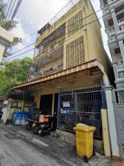 Exterior of multi-story building with gated entrance