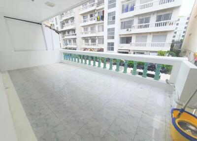 Spacious balcony with tiled floor and railing