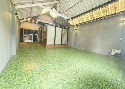 Spacious covered area with tiled floor