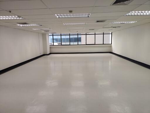 Empty spacious commercial space with large windows