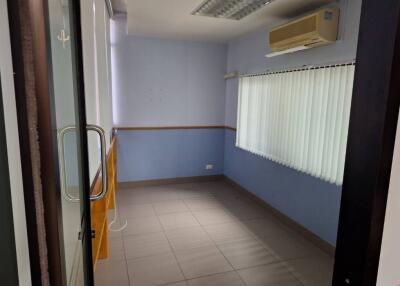 Small room with air conditioner and tiled floor