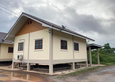 Exterior view of the house with elevated foundation