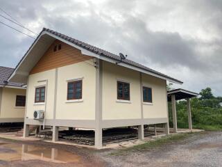 Exterior view of the house with elevated foundation