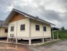 Exterior view of the house with elevated foundation