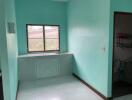 Small kitchen area with a sink and a window