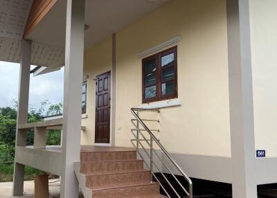 Exterior view of a house with stairs and porch