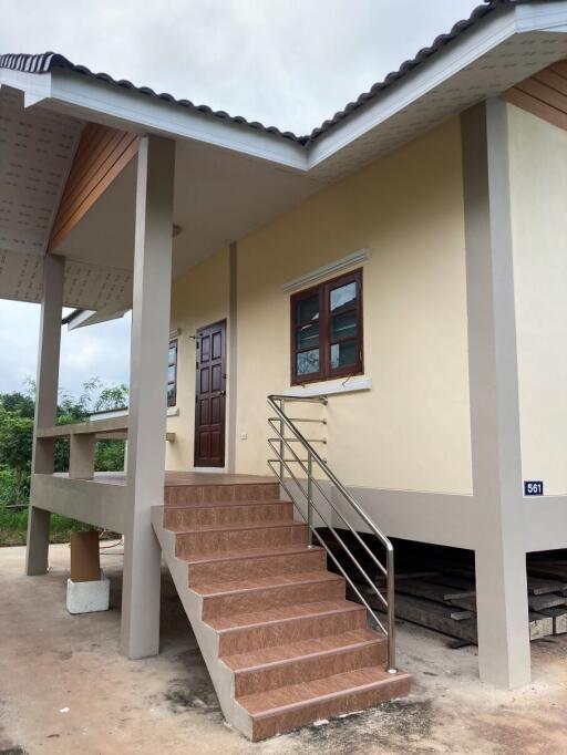 Exterior view of a house with stairs and porch