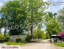 Entrance with trees and greenery