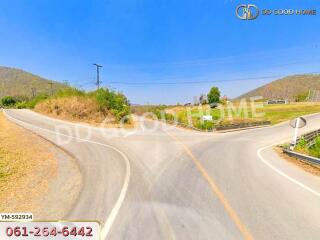 Road intersection in rural area with clear blue sky