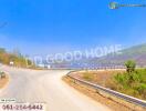 Scenic view of a road with mountains and clear sky