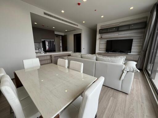 Modern living room with open kitchen and dining area