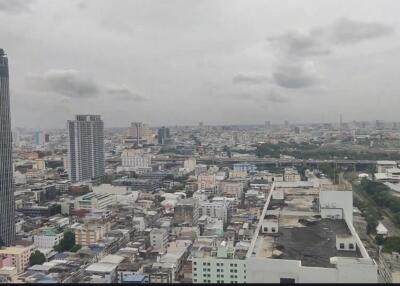 Aerial view of cityscape showing multiple buildings and structures