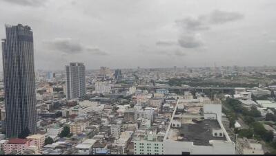 Aerial view of cityscape showing multiple buildings and structures