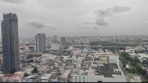 Aerial view of cityscape showing multiple buildings and structures