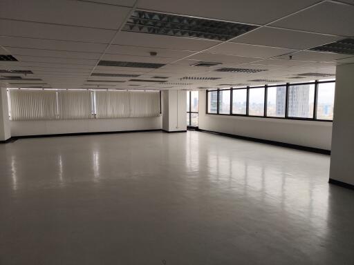 Spacious office area with large windows