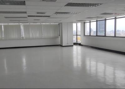 Spacious office area with large windows