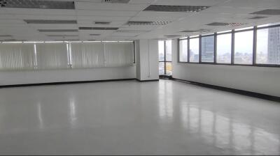 Spacious office area with large windows