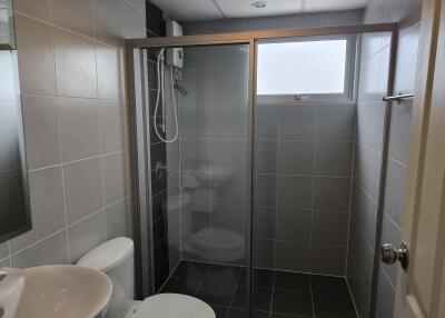 Modern bathroom with glass-enclosed shower