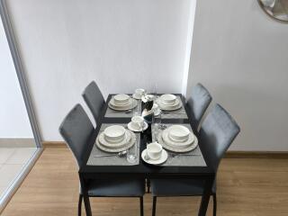 Small dining area with table set for four