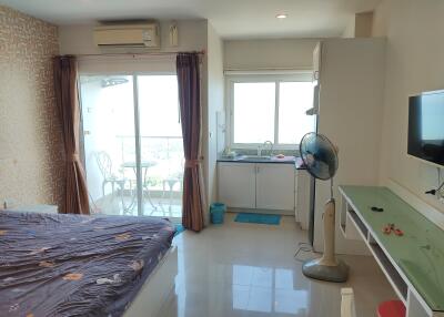 Bedroom with attached balcony and kitchenette