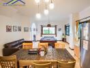 Spacious living room with a dining area, pool table, and modern furnishings