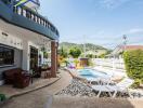 Spacious outdoor area with pool and seating