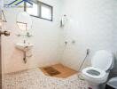 Clean bathroom with white tiles and basic fixtures