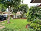 Well-maintained backyard garden with trees and greenery