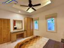 Bedroom with wooden furniture and ceiling fan