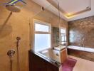 Spacious bathroom with a large bathtub and shower area