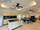 Modern open-plan kitchen and living area with island and dining table