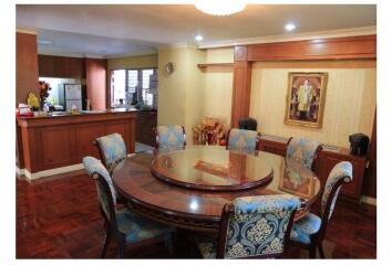 Spacious dining room with adjacent kitchen