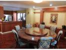 Spacious dining room with adjacent kitchen