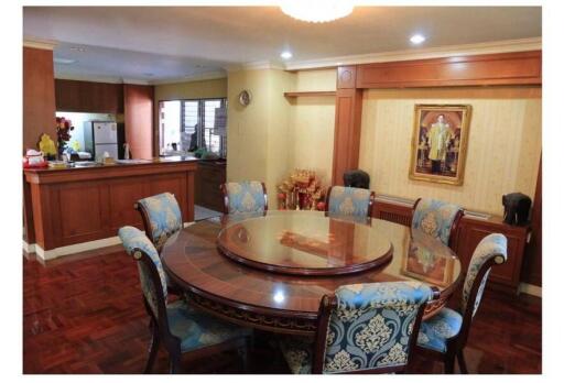 Spacious dining room with adjacent kitchen