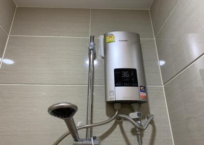 Modern bathroom shower setup with water heater