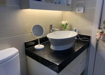 Modern bathroom with vessel sink and vanity