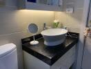 Modern bathroom with vessel sink and vanity