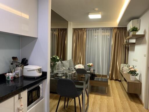 Modern living and dining area with kitchen corner