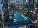 Modern residential complex with illuminated swimming pool