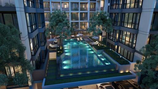 Modern residential complex with illuminated swimming pool