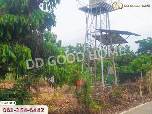 Water tower support structure in a garden